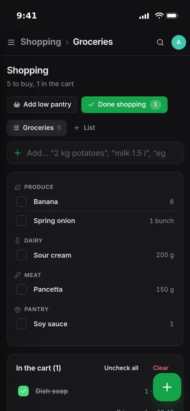 A shopping list on an iPhone grouped into produce, dairy, meat and pantry, with one item in the cart